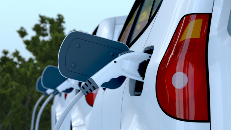 Close up view of white electric vehicle charging